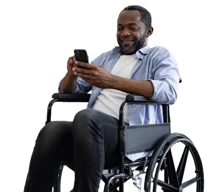 Disabled man in wheelchair using mobile phone